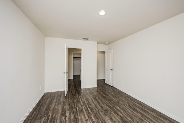 234 Backlash Dr, Gun Barrel City, TX 75156 - unfurnished bedroom with dark wood-style flooring, baseboards, a closet, and recessed lighting
