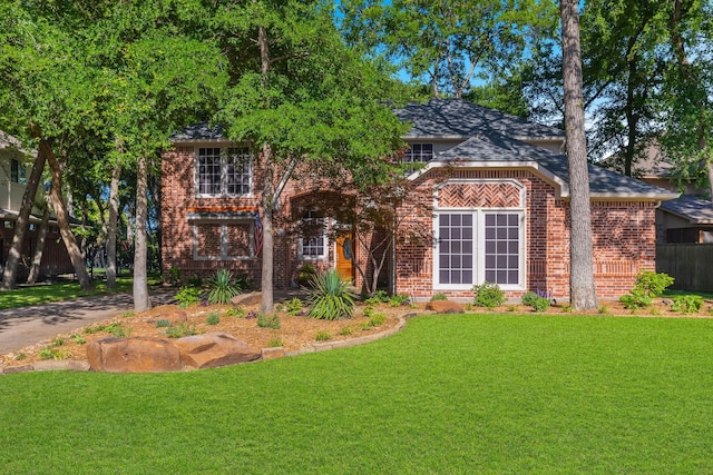 18 Oxford Way, Allen, TX 75002 - view of front of property with a front lawn, brick siding, and a shingled roof