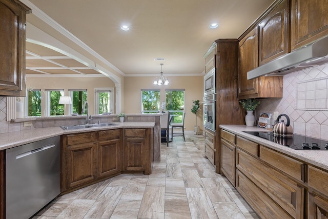 18 Oxford Way, Allen, TX 75002 - kitchen with appliances with stainless steel finishes, a sink, under cabinet range hood, a chandelier, and recessed lighting