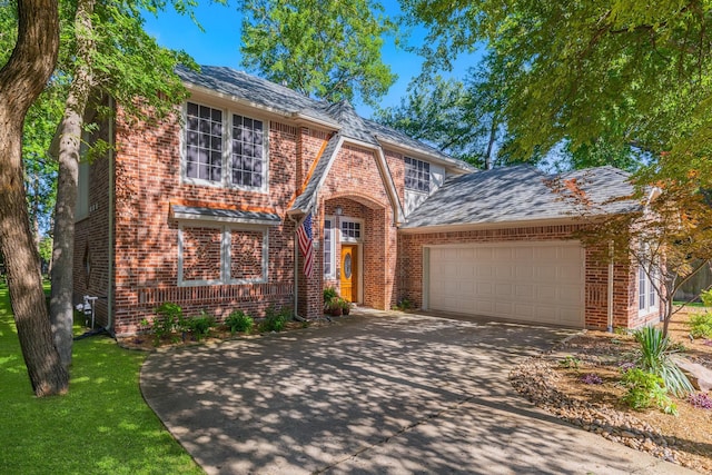 18 Oxford Way, Allen, TX 75002 - view of front facade with brick siding, a garage, concrete driveway, and a front yard