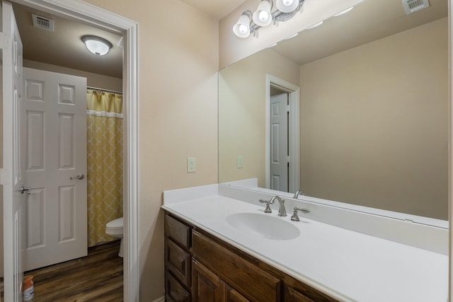 18 Oxford Way, Allen, TX 75002 - full bathroom with toilet, vanity, wood finished floors, and a shower with curtain