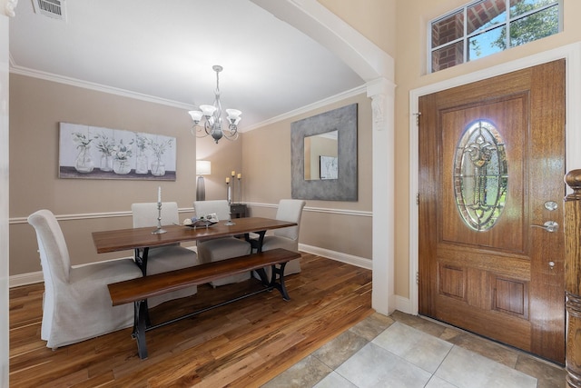 18 Oxford Way, Allen, TX 75002 - entryway featuring ornamental molding, a chandelier, arched walkways, baseboards, and light wood-style flooring