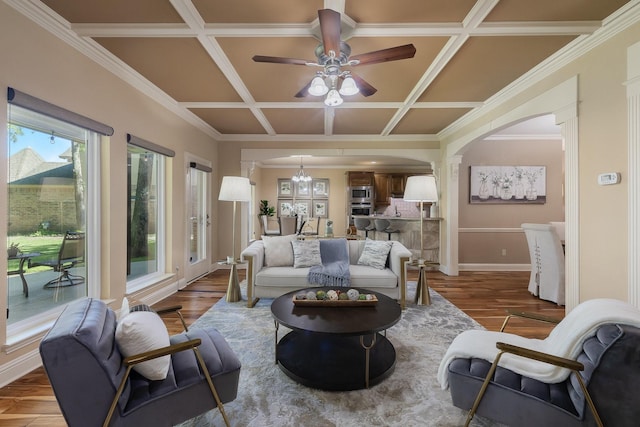 18 Oxford Way, Allen, TX 75002 - living area with coffered ceiling, arched walkways, ceiling fan, wood finished floors, and baseboards