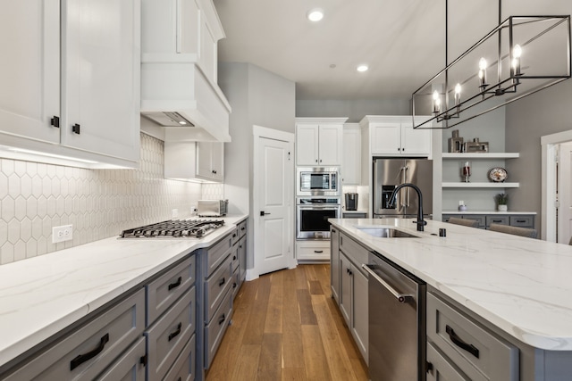 3900 Dalea Dr, Prosper, TX 75078 - kitchen featuring stainless steel appliances, a sink, open shelves, gray cabinetry, and recessed lighting