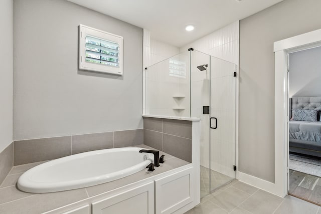 3900 Dalea Dr, Prosper, TX 75078 - ensuite bathroom featuring a garden tub, a stall shower, and tile patterned floors