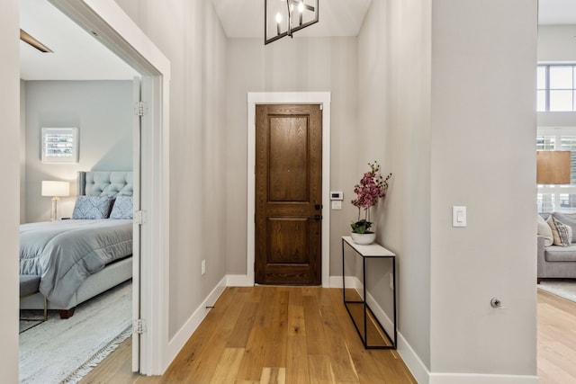 3900 Dalea Dr, Prosper, TX 75078 - foyer featuring light wood-type flooring, a chandelier, and baseboards