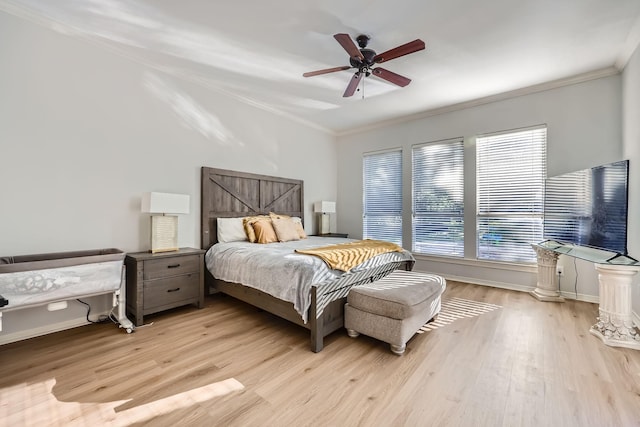 618 Oak Tree Cv, Cedar Hill, TX 75104 - bedroom with crown molding, light wood-style floors, baseboards, and ceiling fan