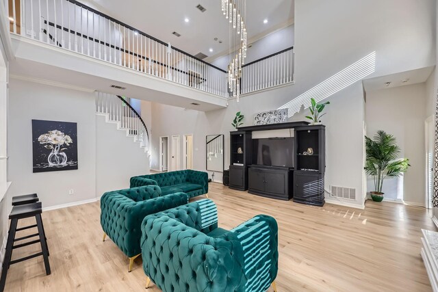 618 Oak Tree Cv, Cedar Hill, TX 75104 - living room with a high ceiling, light wood-style flooring, baseboards, stairs, and recessed lighting