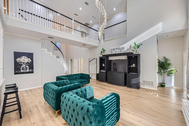 618 Oak Tree Cv, Cedar Hill, TX 75104 - living area with a towering ceiling, wood finished floors, stairway, and baseboards