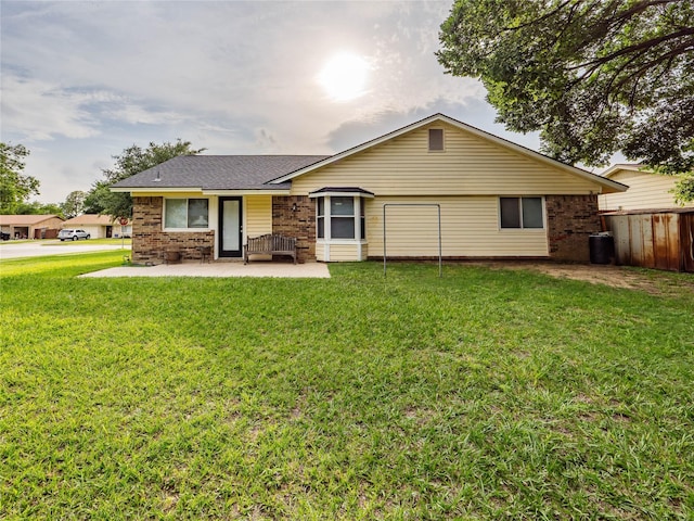 2036 Pearl Ln, Irving, TX 75060 - ranch-style home featuring a patio area, brick siding, and a shingled roof