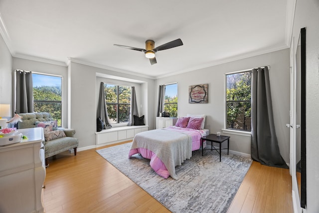 510 Columbia Dr, Rockwall, TX 75032 - bedroom featuring ornamental molding, light wood finished floors, baseboards, and a ceiling fan