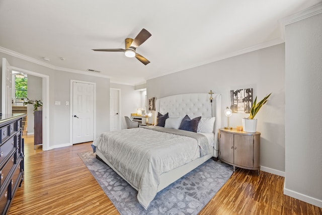 510 Columbia Dr, Rockwall, TX 75032 - bedroom with wood finished floors, baseboards, ornamental molding, and a ceiling fan