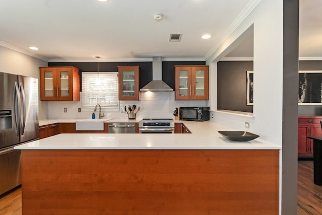 9914 Woodgrove Dr, Dallas, TX 75218 - kitchen featuring wall chimney exhaust hood, a sink, stainless steel appliances, ornamental molding, and light countertops