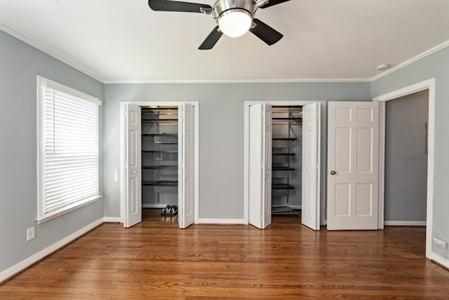 9914 Woodgrove Dr, Dallas, TX 75218 - unfurnished bedroom featuring multiple closets, ornamental molding, multiple windows, and baseboards