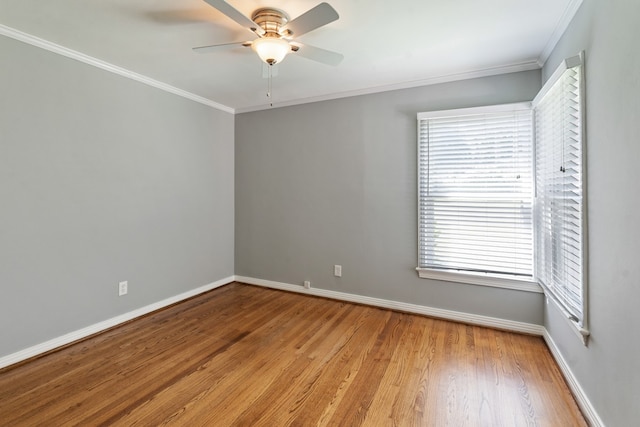9914 Woodgrove Dr, Dallas, TX 75218 - spare room featuring baseboards, light wood-style flooring, crown molding, ceiling fan, and healthy amount of natural light