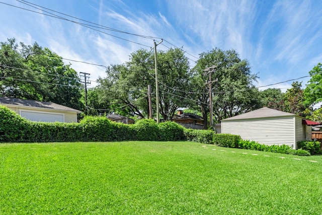 9914 Woodgrove Dr, Dallas, TX 75218 - view of green lawn with a garage