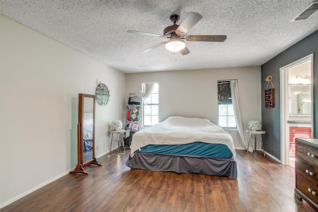 1312 Robyn Rd, Azle, TX 76020 - bedroom with wood finished floors, baseboards, a textured ceiling, and a ceiling fan