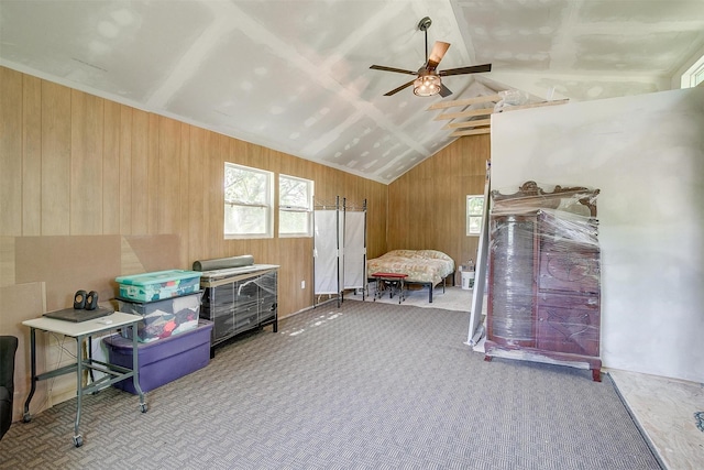 1312 Robyn Rd, Azle, TX 76020 - bedroom featuring wood walls, lofted ceiling, carpet floors, and ceiling fan
