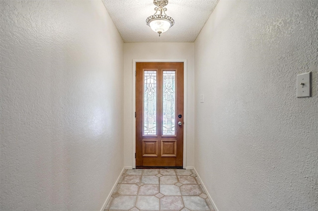 1312 Robyn Rd, Azle, TX 76020 - doorway featuring a textured wall, baseboards, and light tile patterned flooring