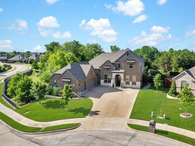318 Arcadia Way, Rockwall, TX 75087 - view of front of house with brick siding, driveway, and a garage