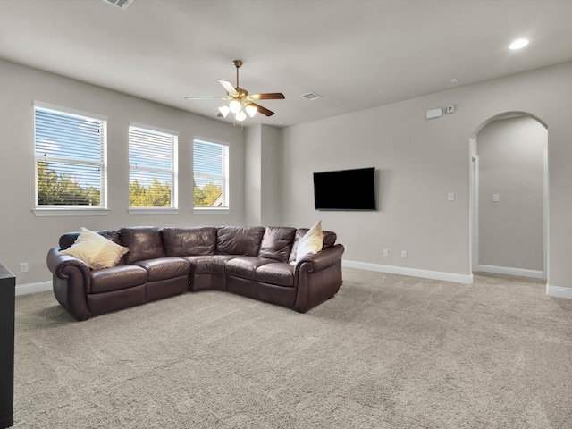318 Arcadia Way, Rockwall, TX 75087 - living room featuring arched walkways, light colored carpet, a ceiling fan, baseboards, and recessed lighting