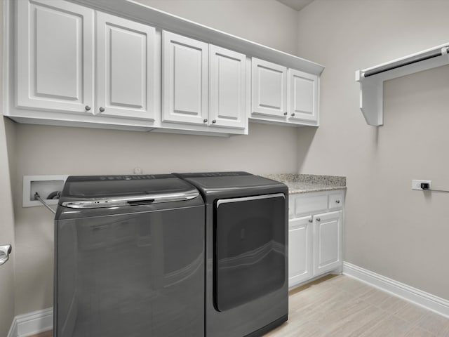 318 Arcadia Way, Rockwall, TX 75087 - washroom with cabinet space, independent washer and dryer, and baseboards