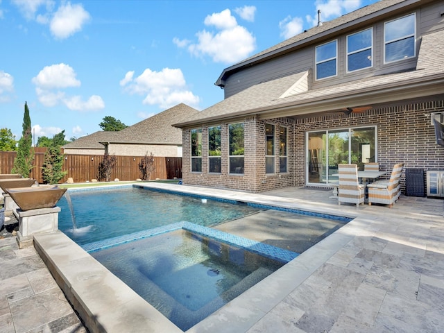 318 Arcadia Way, Rockwall, TX 75087 - view of swimming pool with a patio, a fenced backyard, a pool with connected hot tub, and outdoor dining area