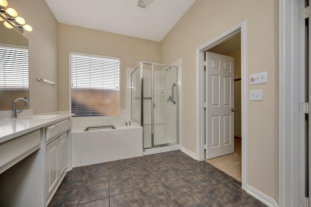 8256 Bridge St, North Richland Hills, TX 76180 - full bathroom featuring vanity, a bath, and a stall shower