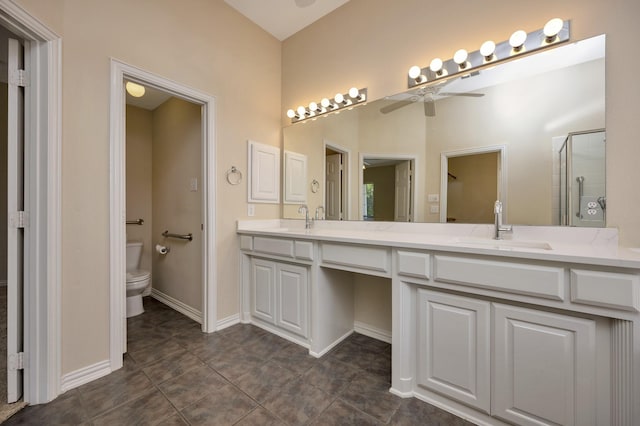 8256 Bridge St, North Richland Hills, TX 76180 - bathroom featuring double vanity, a ceiling fan, toilet, a shower stall, and baseboards