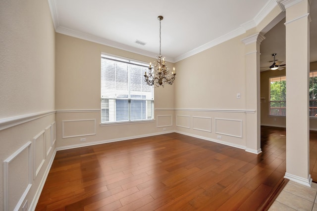 8256 Bridge St, North Richland Hills, TX 76180 - unfurnished room with ornate columns, a chandelier, crown molding, a ceiling fan, and light wood-style floors
