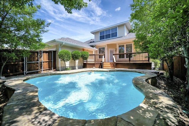 8256 Bridge St, North Richland Hills, TX 76180 - view of swimming pool with a deck and a fenced backyard