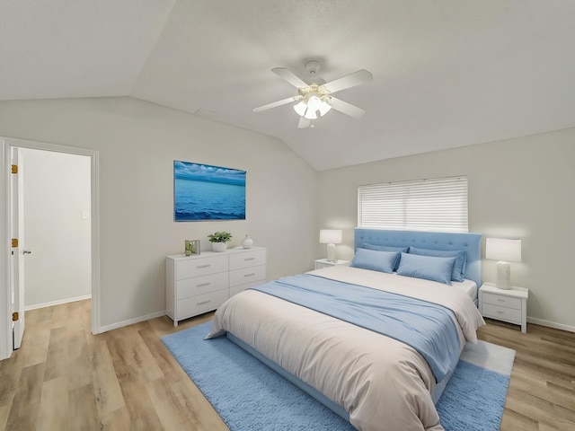 300 Lark Ln, Euless, TX 76039 - bedroom with vaulted ceiling, light wood-style flooring, baseboards, and a ceiling fan
