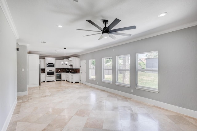 3005 S Jennings Ave, Fort Worth, TX 76110 - unfurnished living room with ornamental molding, a ceiling fan, recessed lighting, baseboards, and beverage cooler