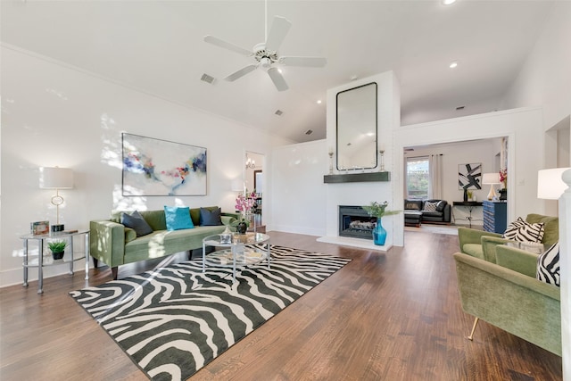 7709 Westwind Dr, Fort Worth, TX 76179 - living area with lofted ceiling, wood finished floors, ceiling fan, a fireplace with raised hearth, and recessed lighting