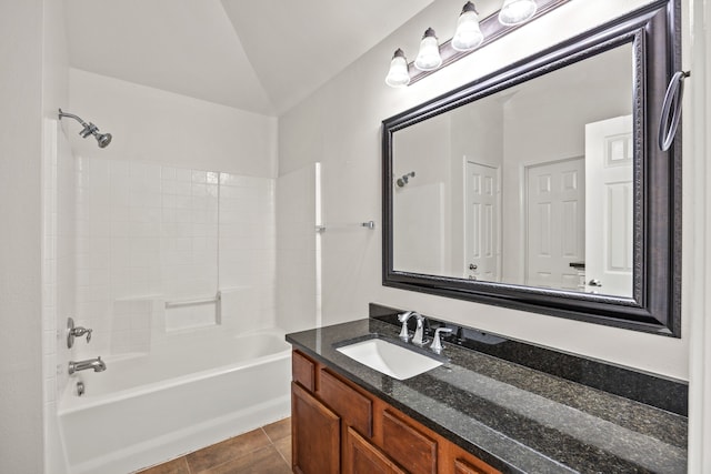 332 Butternut Dr, Fate, TX 75087 - bathroom featuring vanity, bathtub / shower combination, tile patterned floors, and lofted ceiling