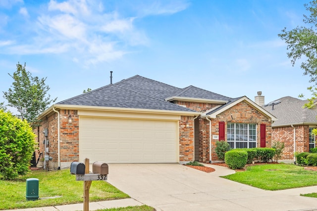 332 Butternut Dr, Fate, TX 75087 - view of front of property featuring a garage, driveway, roof with shingles, brick siding, and a front lawn