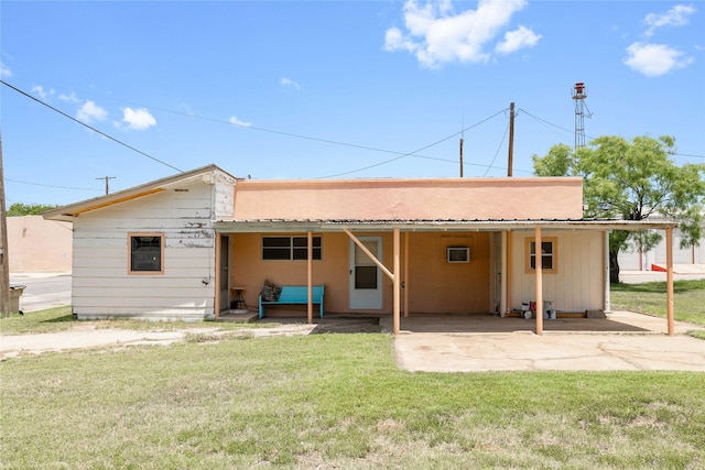 201 S 1st St, Bangs, TX 76823 - rear view of house featuring a carport and a yard