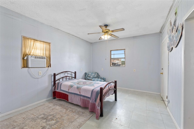 201 S 1st St, Bangs, TX 76823 - bedroom with cooling unit, a textured ceiling, a ceiling fan, and baseboards