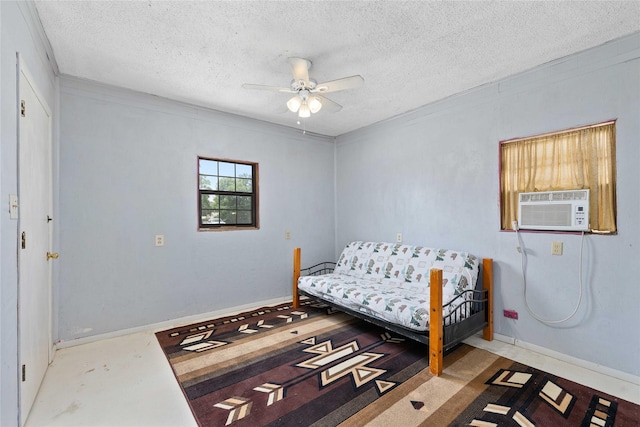 201 S 1st St, Bangs, TX 76823 - bedroom featuring a textured ceiling, cooling unit, a ceiling fan, and baseboards