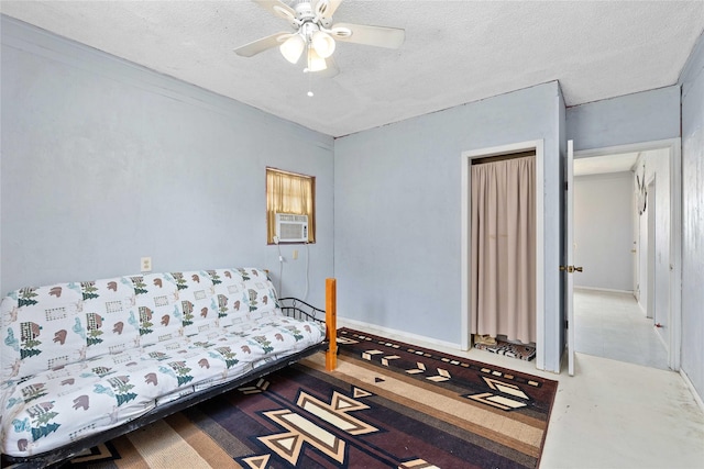 201 S 1st St, Bangs, TX 76823 - bedroom featuring a textured ceiling, a ceiling fan, and cooling unit