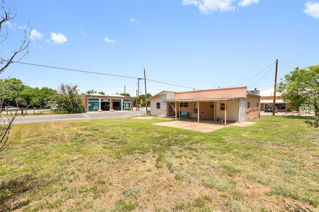 201 S 1st St, Bangs, TX 76823 - view of green lawn with a patio area