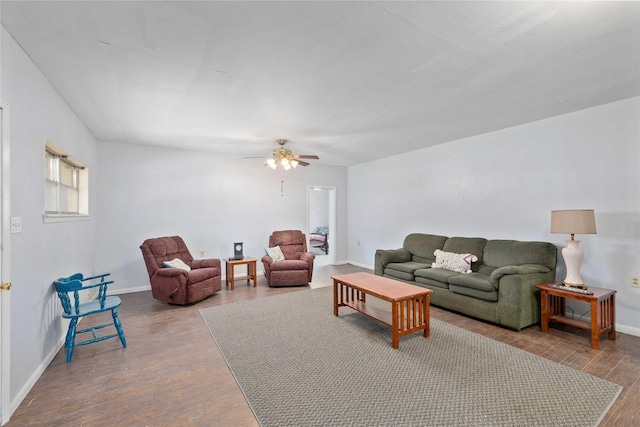 201 S 1st St, Bangs, TX 76823 - living area with wood finished floors, baseboards, and a ceiling fan