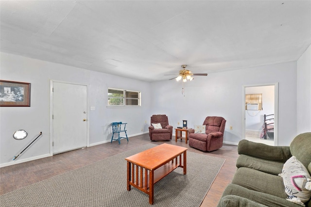 201 S 1st St, Bangs, TX 76823 - living room featuring wood finished floors, ceiling fan, and baseboards