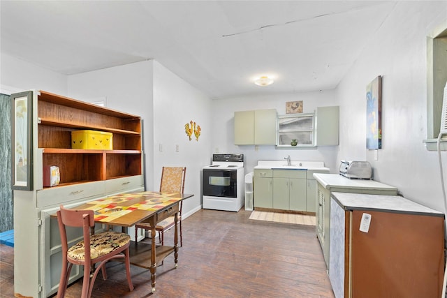 201 S 1st St, Bangs, TX 76823 - kitchen featuring electric stove, open shelves, dark wood-style floors, a sink, and green cabinets