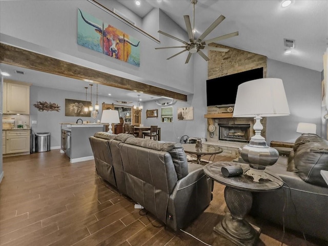 7409 Harbor Dr, Rowlett, TX 75088 - living room featuring a stone fireplace, ceiling fan, vaulted ceiling, dark wood-style floors, and baseboards