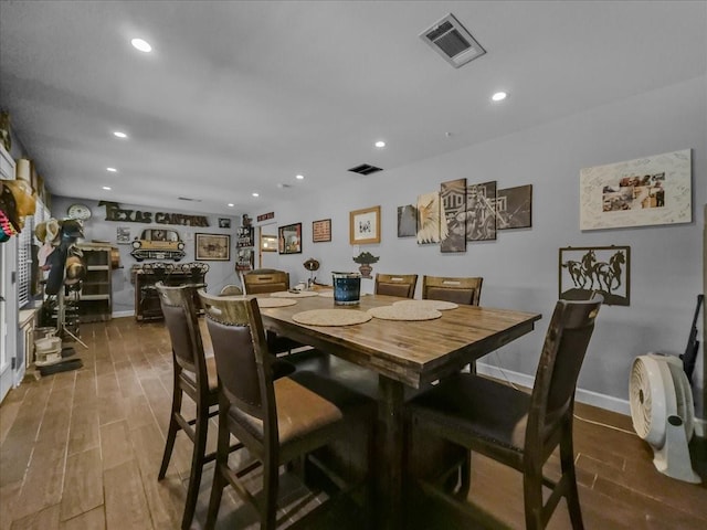 7409 Harbor Dr, Rowlett, TX 75088 - dining space featuring recessed lighting, wood finished floors, and baseboards