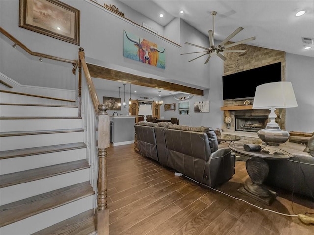 7409 Harbor Dr, Rowlett, TX 75088 - living area with wood finished floors, a ceiling fan, stairs, a stone fireplace, and recessed lighting
