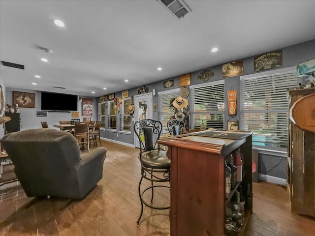 7409 Harbor Dr, Rowlett, TX 75088 - indoor dry bar featuring wood finished floors, recessed lighting, and baseboards