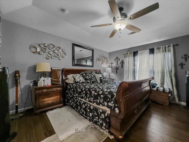 7409 Harbor Dr, Rowlett, TX 75088 - bedroom featuring wood finished floors, baseboards, and a ceiling fan