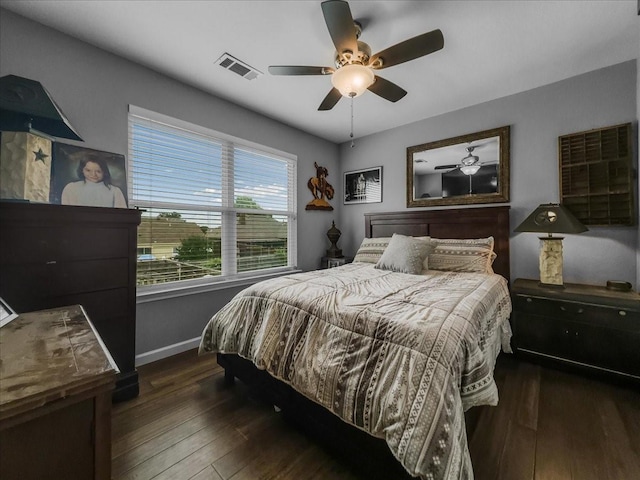7409 Harbor Dr, Rowlett, TX 75088 - bedroom with wood-type flooring, baseboards, and a ceiling fan